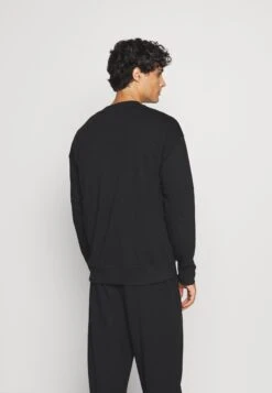 Maglia Del PigiamaBlack Uomo Per La Notte C1182N01O-Q11 -DeFacto Italia 2025 d4d466f0fb864558ae5cdf7d828f4f5a